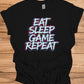 Gamer's Mantra: Eat Sleep Game Repeat, Graffiti-Style Typography, Vibrant 3D Design, Gaming Lifestyle Artwork - Graphic Tee Shirt