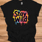 Stay Wild: Vibrant Typographic Art, Graffiti-Inspired Design, Colorful Paint Splatter Background - Graphic Tee Shirt