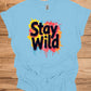 Stay Wild: Vibrant Typographic Art, Graffiti-Inspired Design, Colorful Paint Splatter Background - Graphic Tee Shirt