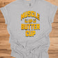 Muscle Up Buttercup: Retro Fitness Motivation, Grungy Gym Typography, Bold Yellow on Black Design - Graphic Tee Shirt