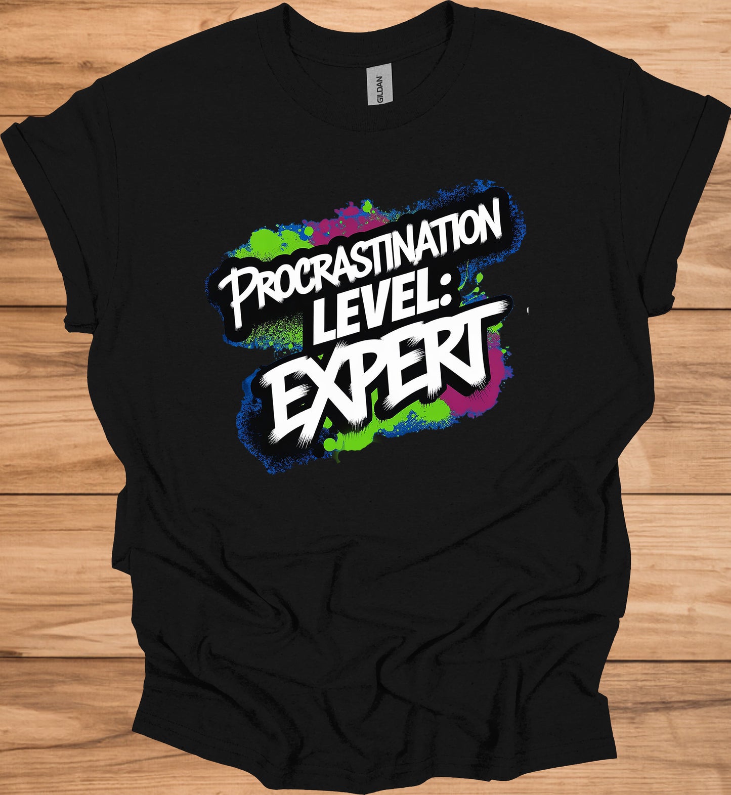 Procrastination Prowess: Graffiti-Style Typography, Vibrant Splatter Background, Humorous Self-Deprecating Message - Graphic Tee Shirt