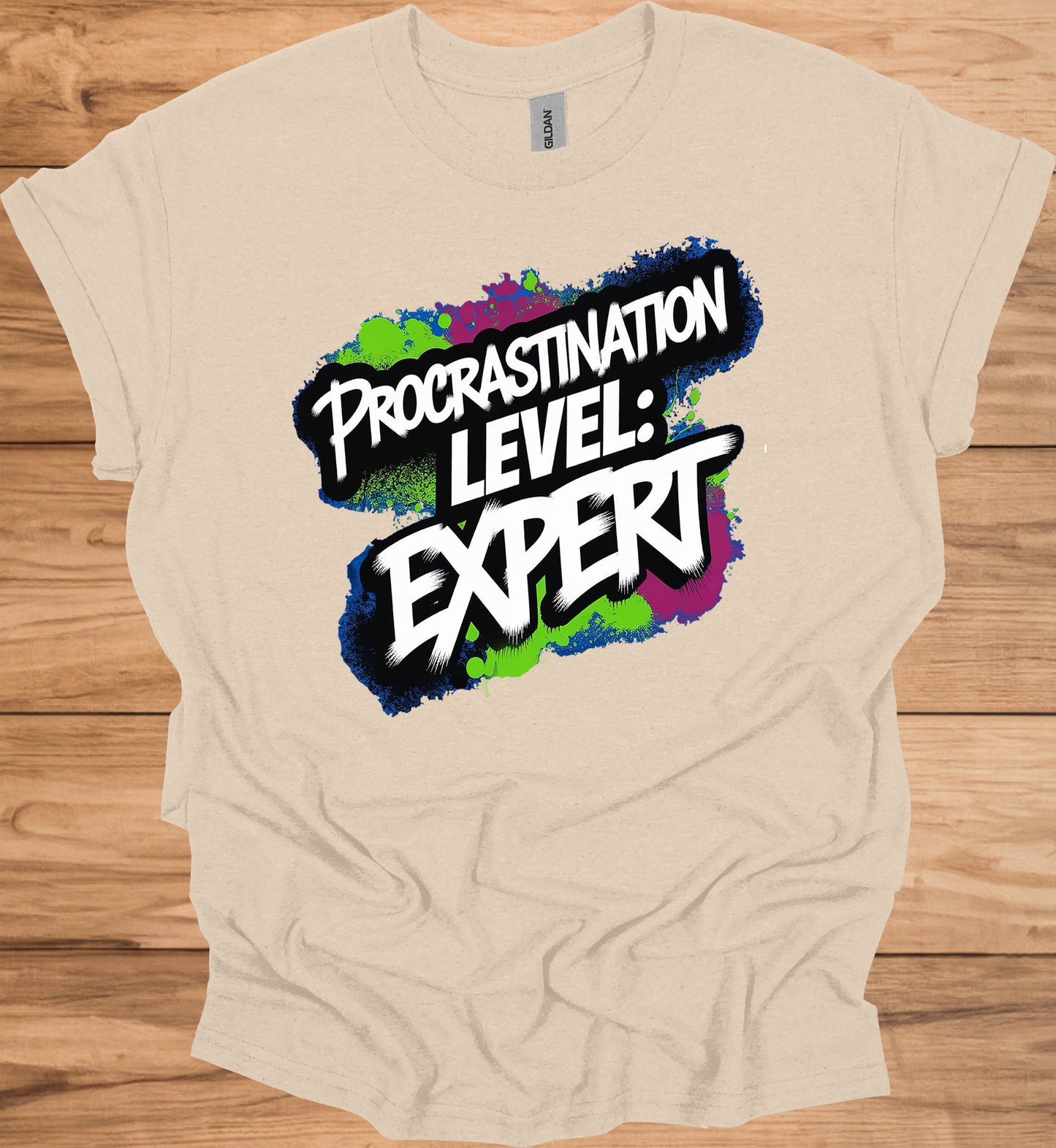 Procrastination Prowess: Graffiti-Style Typography, Vibrant Splatter Background, Humorous Self-Deprecating Message - Graphic Tee Shirt