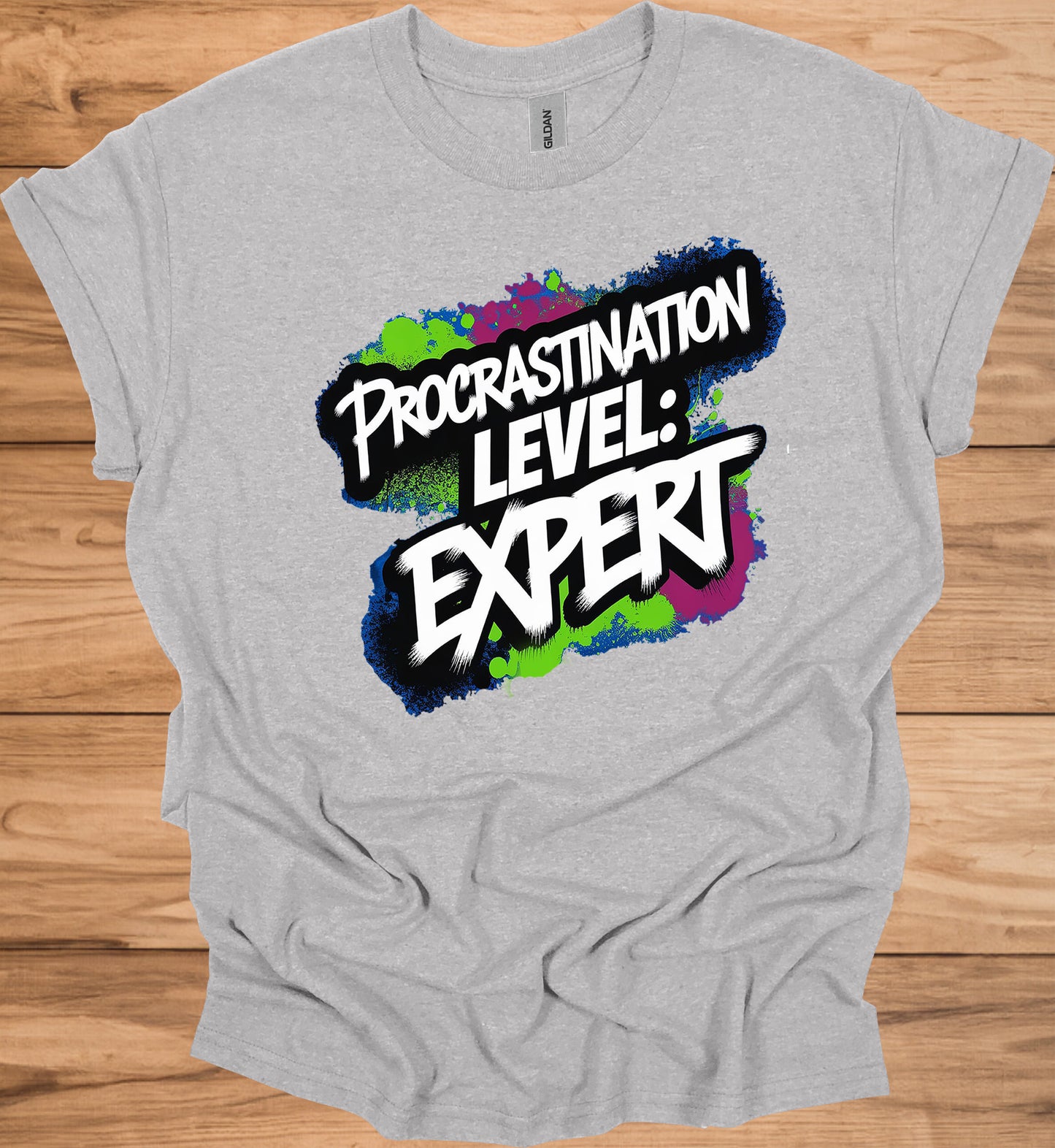 Procrastination Prowess: Graffiti-Style Typography, Vibrant Splatter Background, Humorous Self-Deprecating Message - Graphic Tee Shirt