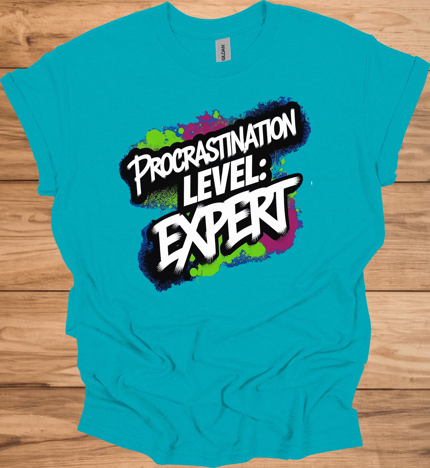 Procrastination Prowess: Graffiti-Style Typography, Vibrant Splatter Background, Humorous Self-Deprecating Message - Graphic Tee Shirt