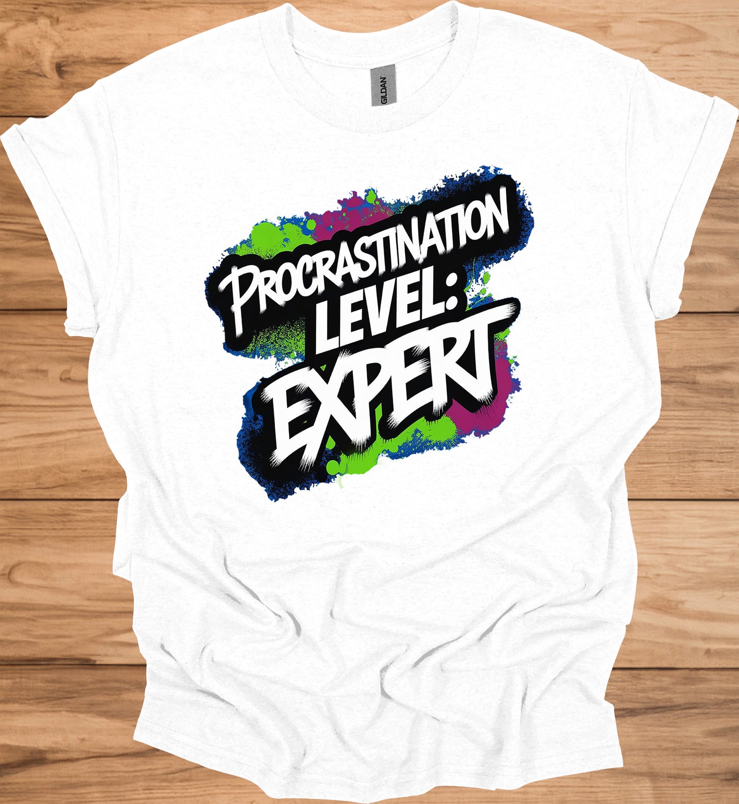 Procrastination Prowess: Graffiti-Style Typography, Vibrant Splatter Background, Humorous Self-Deprecating Message - Graphic Tee Shirt