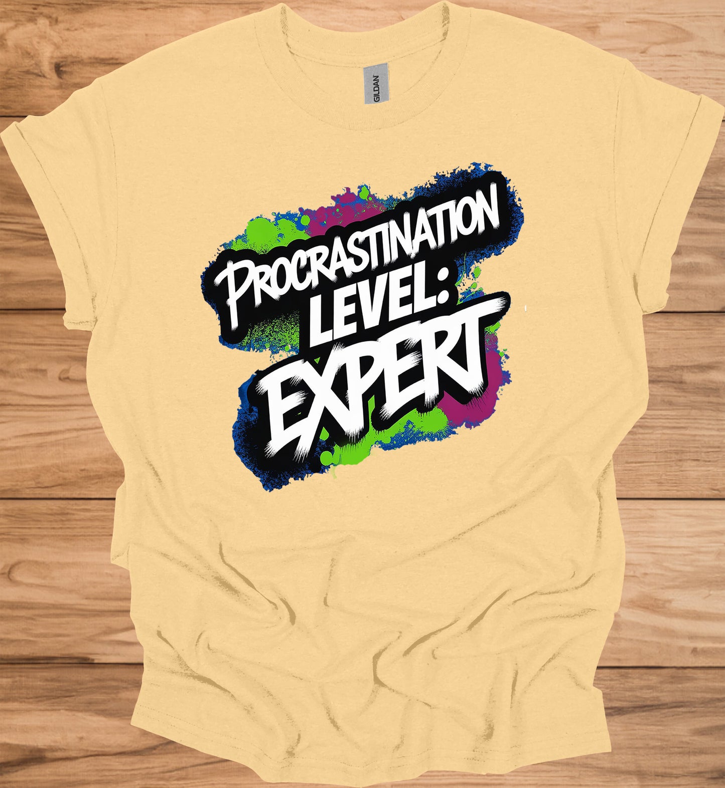 Procrastination Prowess: Graffiti-Style Typography, Vibrant Splatter Background, Humorous Self-Deprecating Message - Graphic Tee Shirt