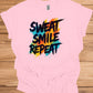 Sweat Smile Repeat: Motivational Fitness Quote, Graffiti Style Typography, Vibrant Colorful Background - Graphic Tee Shirt
