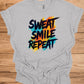 Sweat Smile Repeat: Motivational Fitness Quote, Graffiti Style Typography, Vibrant Colorful Background - Graphic Tee Shirt